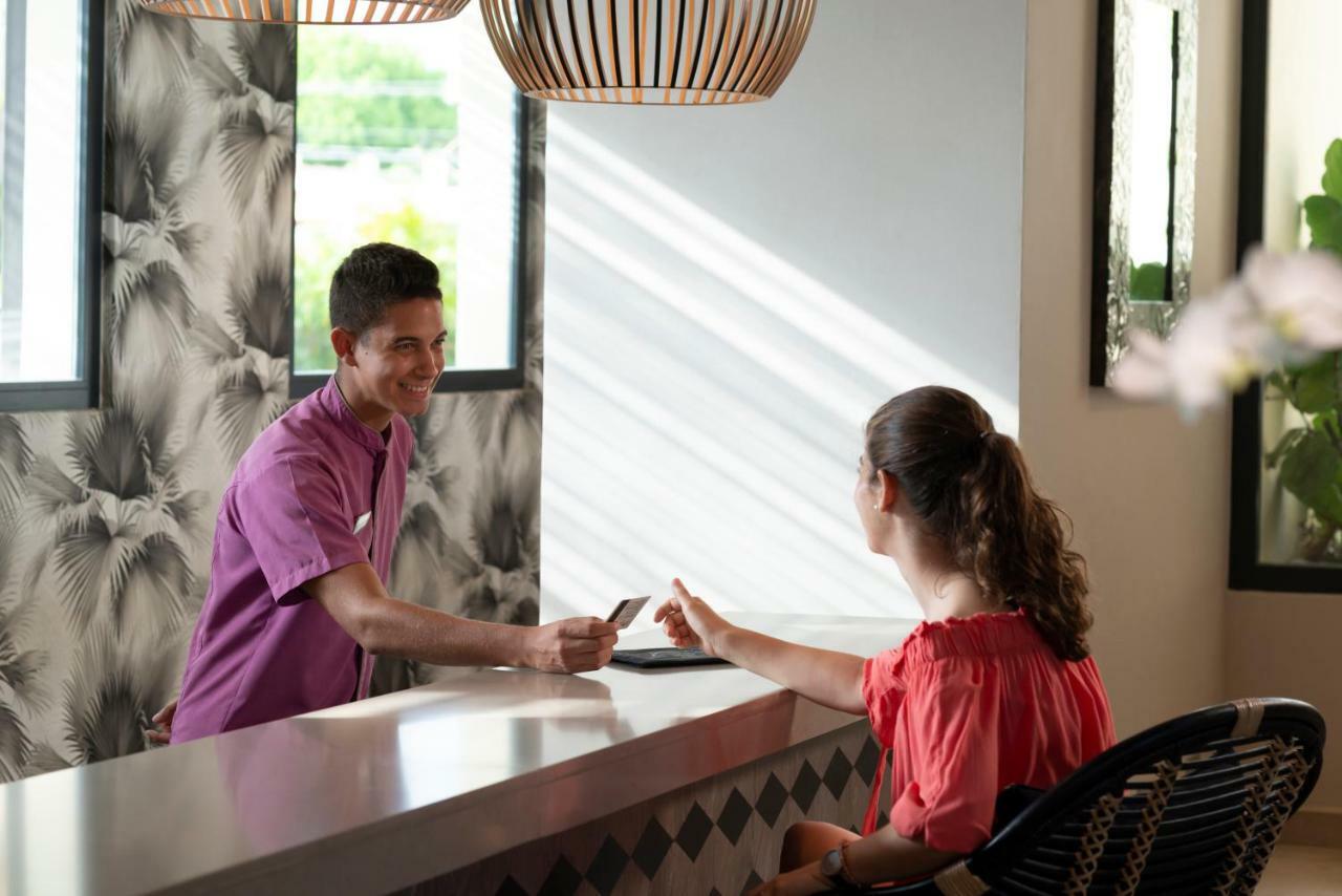 Catalonia Royal La Romana Adults Only Bayahibe Exterior photo A guest checking in at the front desk of a hotel